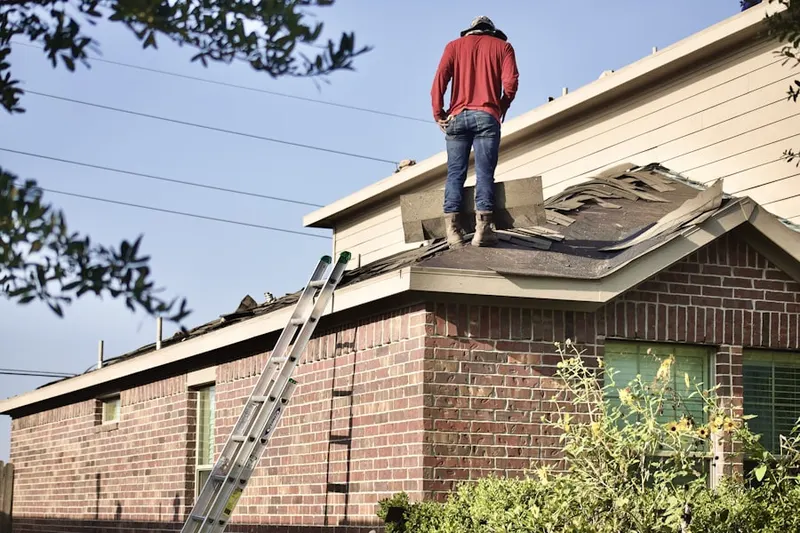 Professional roofer working on a residential roof in Miraleste